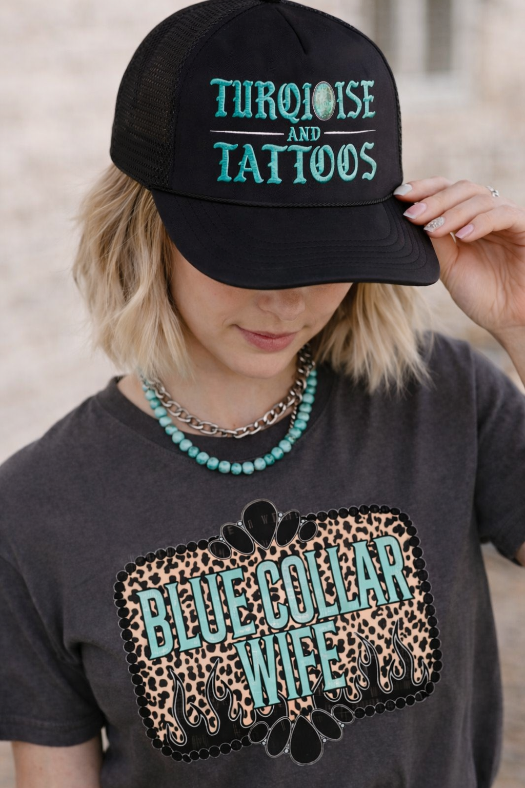 Turquoise and tattoos trucker hat